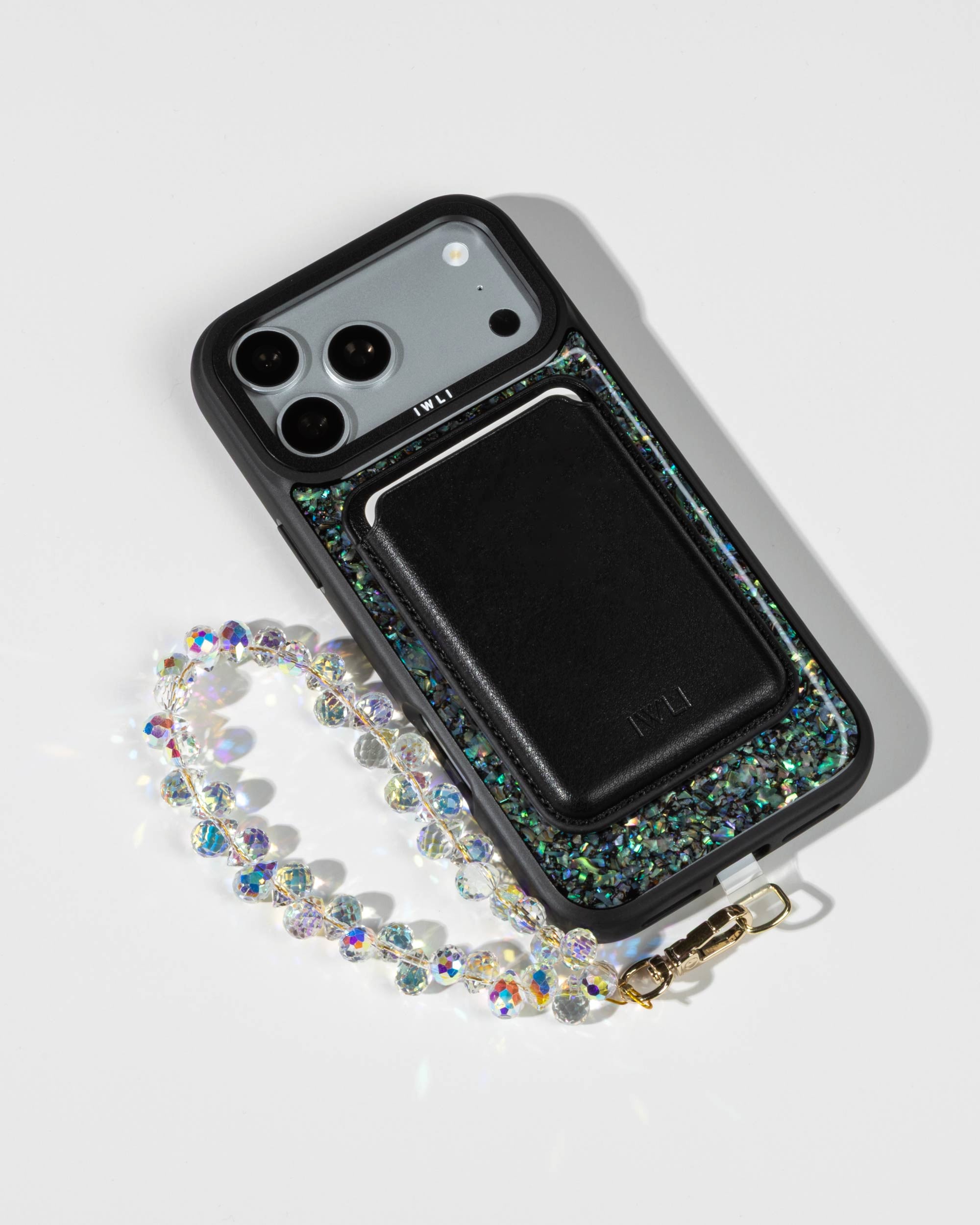 Black Muse MagSafe Wallet attached to an Abalone Pearl iPhone Case