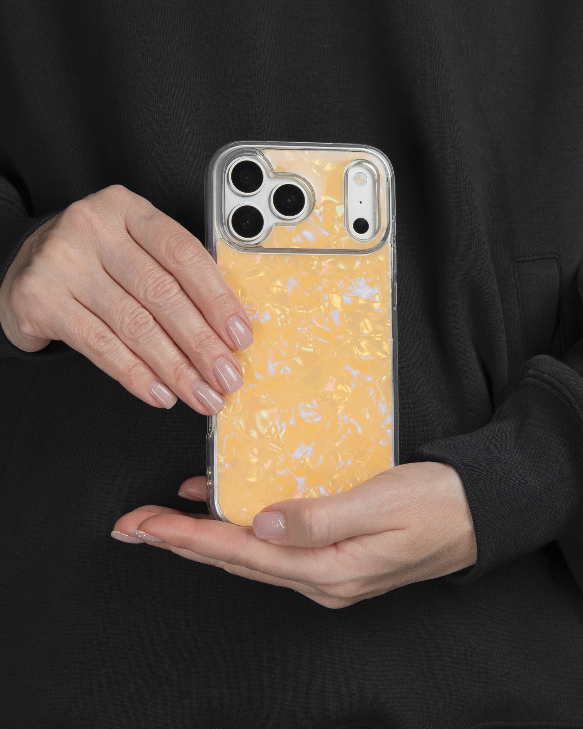 Apricot Shell iPhone Case held in both hands, iPhone 17 Pro Max