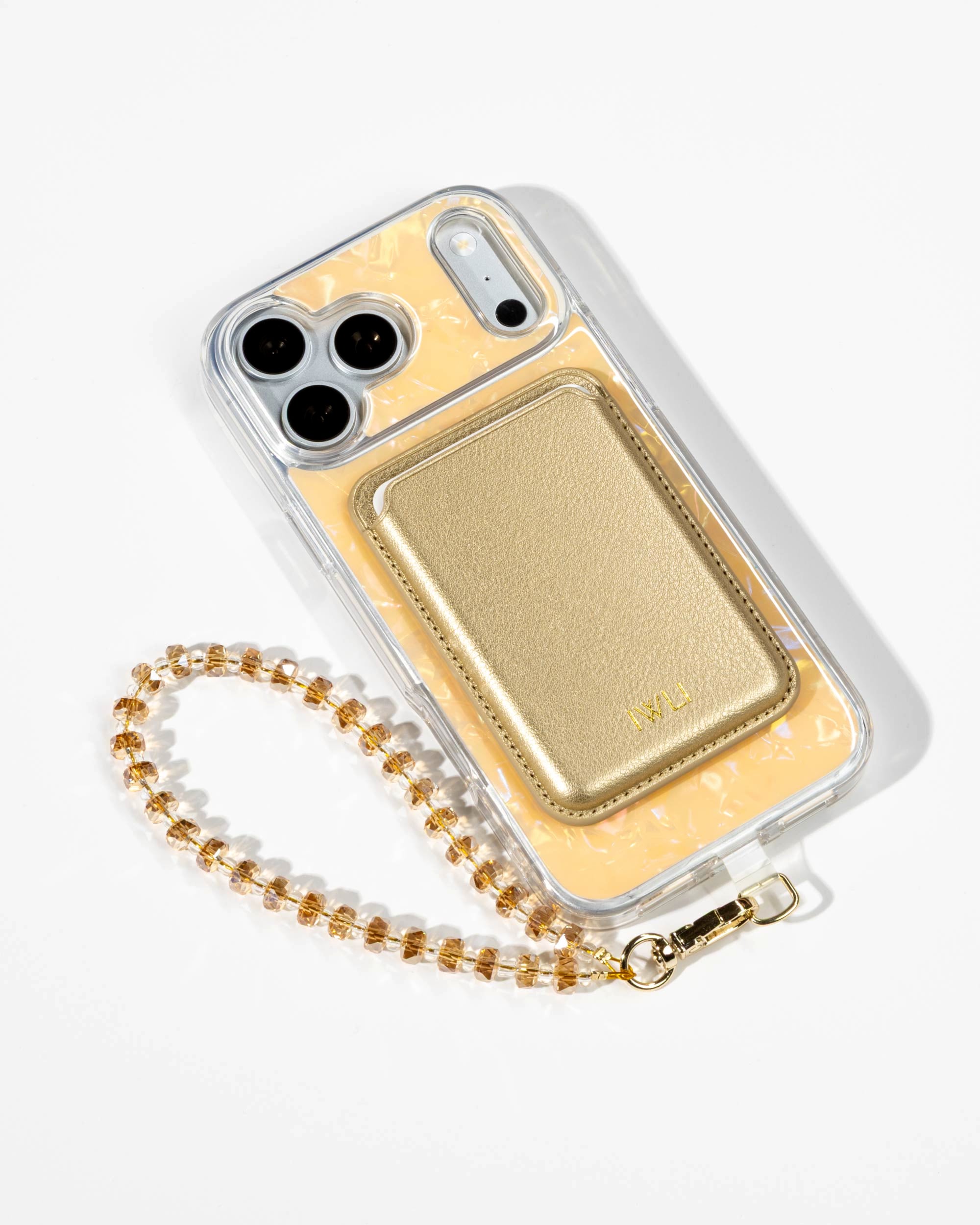 Apricot Shell iPhone Case with a Gold Muse MagSafe Wallet attached