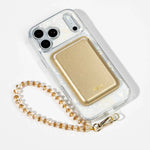 White Shell iPhone Case with a Gold Muse MagSafe Wallet attached