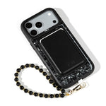Black Shell iPhone Case with a Black Muse MagSafe Wallet attached