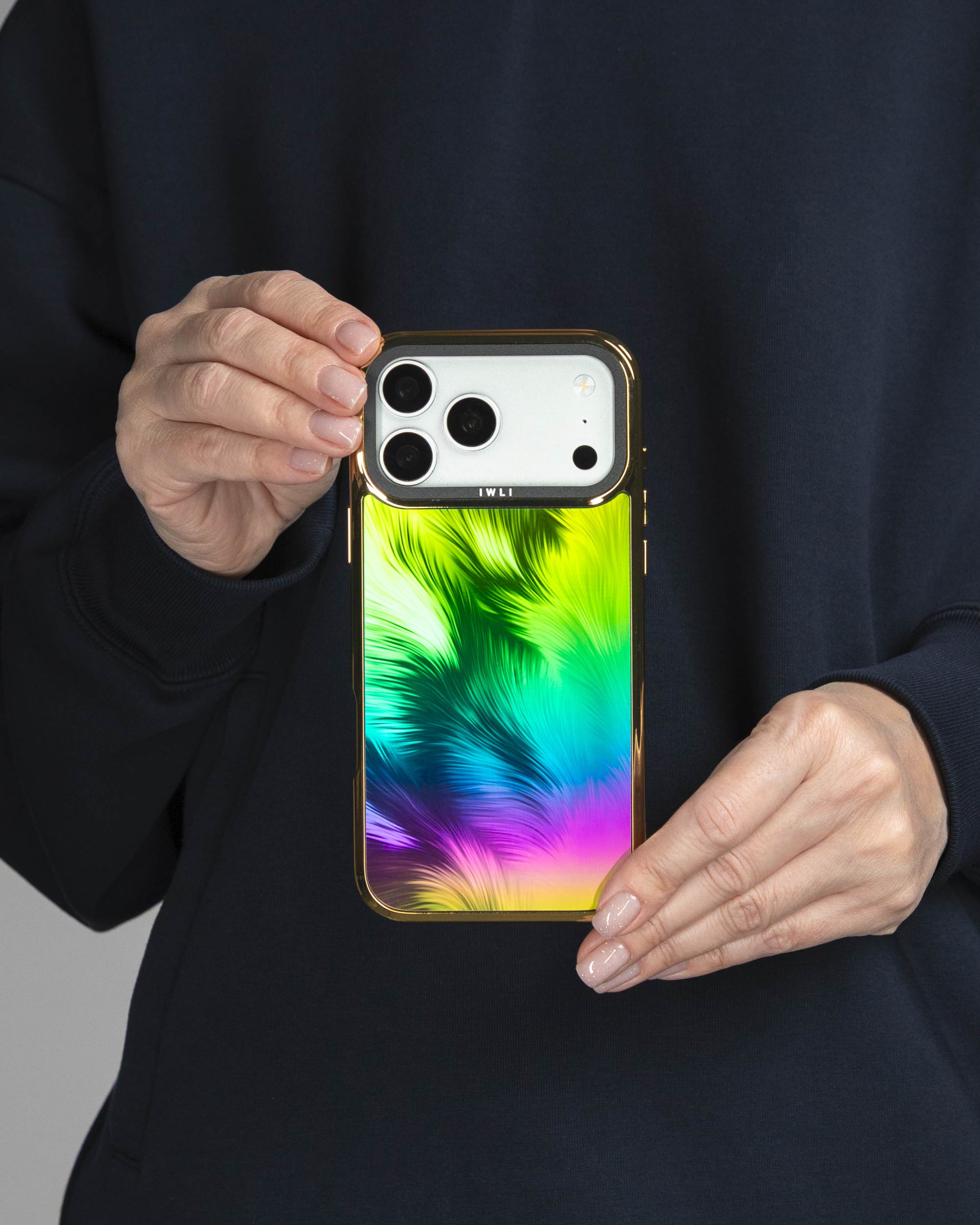 Peacock Feather Holo iPhone Case held in both hands, iPhone 17 Pro Max