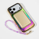 Peacock Feather Holo iPhone Case with a Gold Muse MagSafe Wallet attached