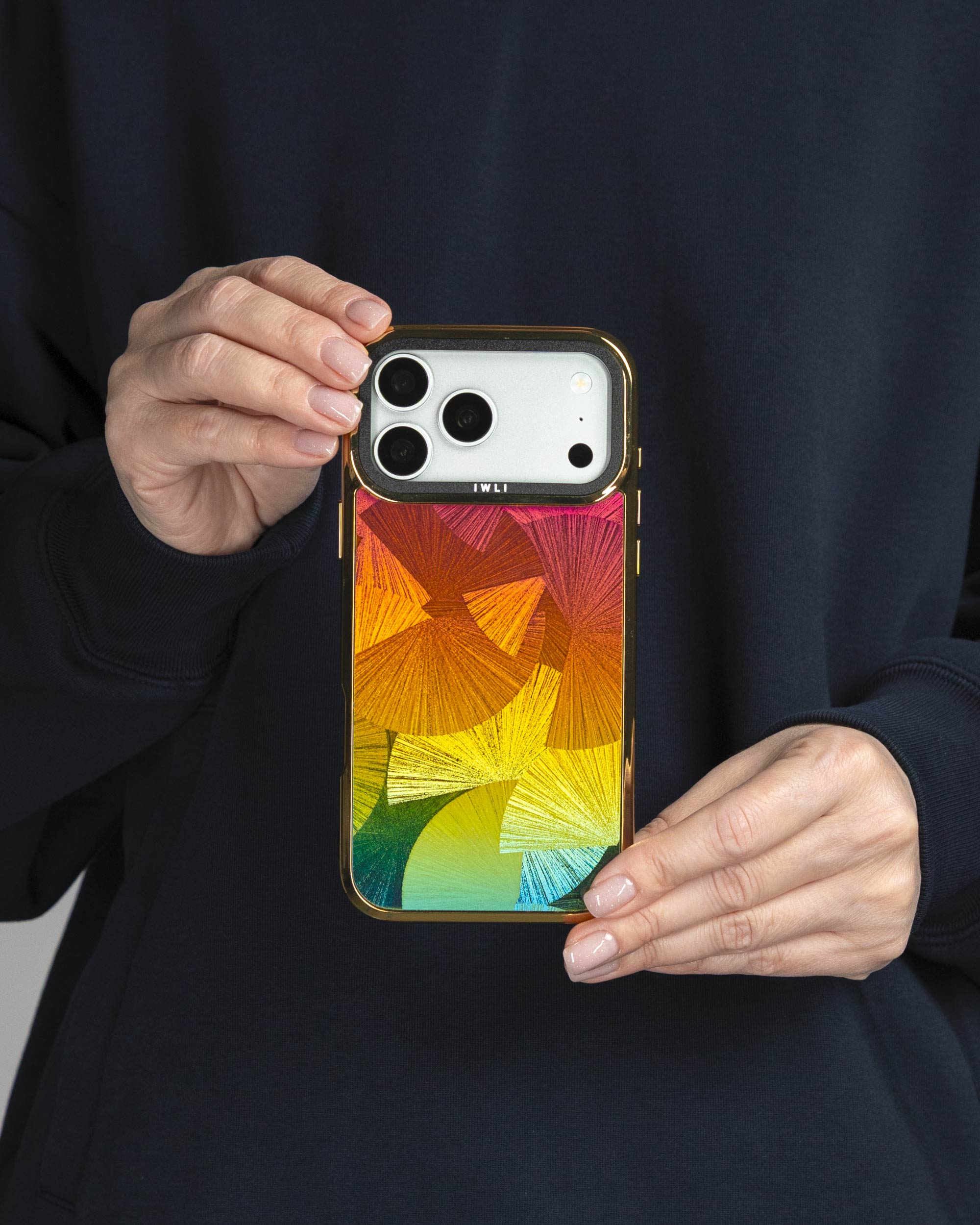 Sunset Fan Holo iPhone Case held in both hands, iPhone 17 Pro Max