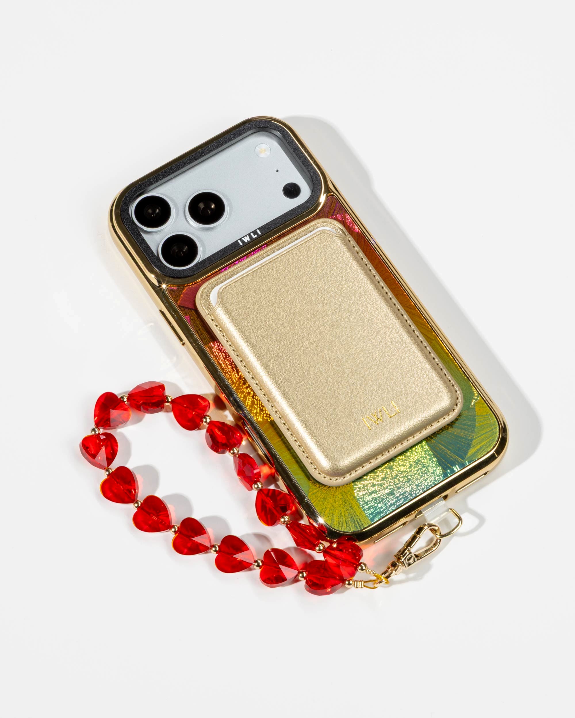 Sunset Fan Holo iPhone Case with a Gold Muse MagSafe Wallet attached