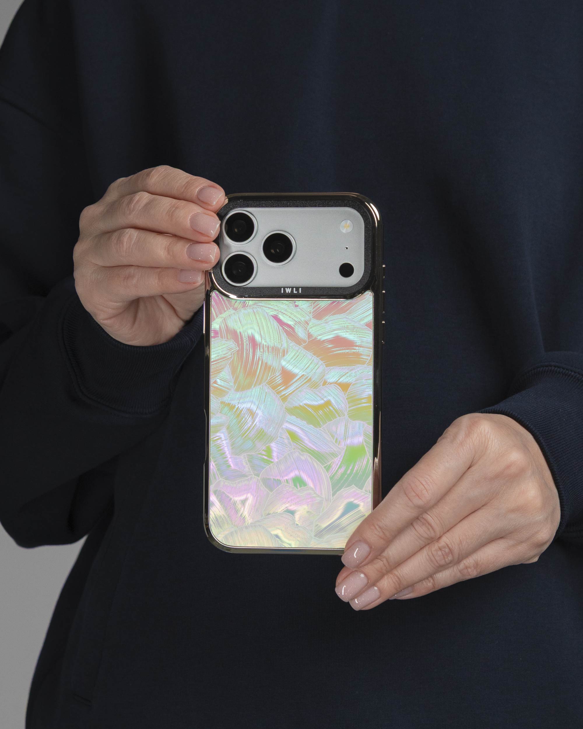 Pastel Petal Holo iPhone Case held in both hands, iPhone 17 Pro Max