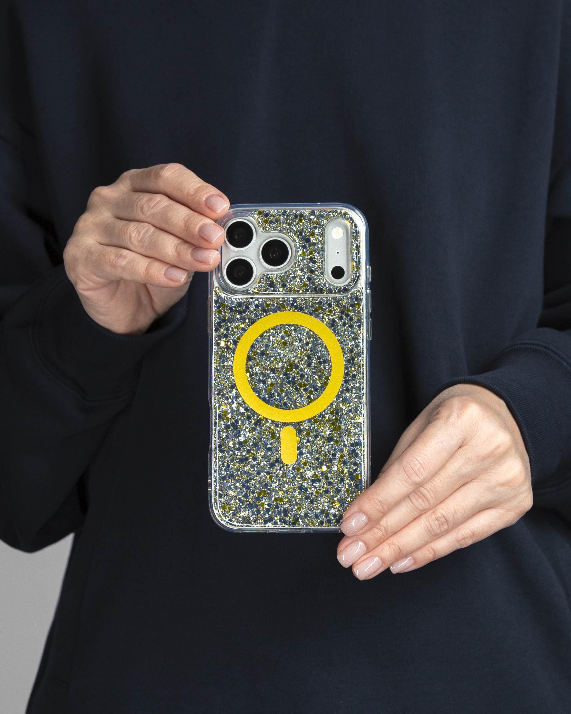 Starlight Sparkle iPhone Case held in both hands, iPhone 17 Pro Max