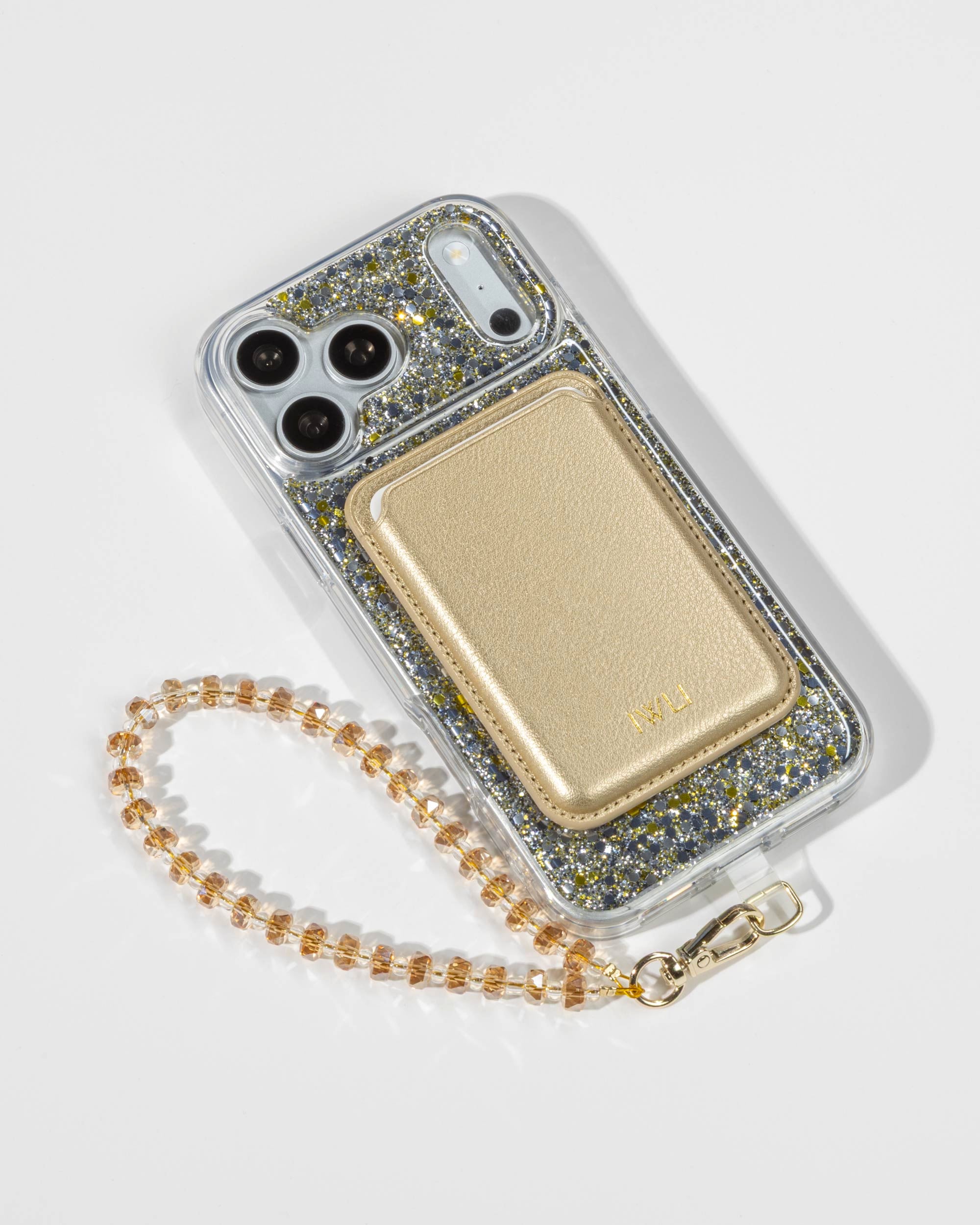Starlight Sparkle iPhone Case with a Gold Muse MagSafe Wallet attached