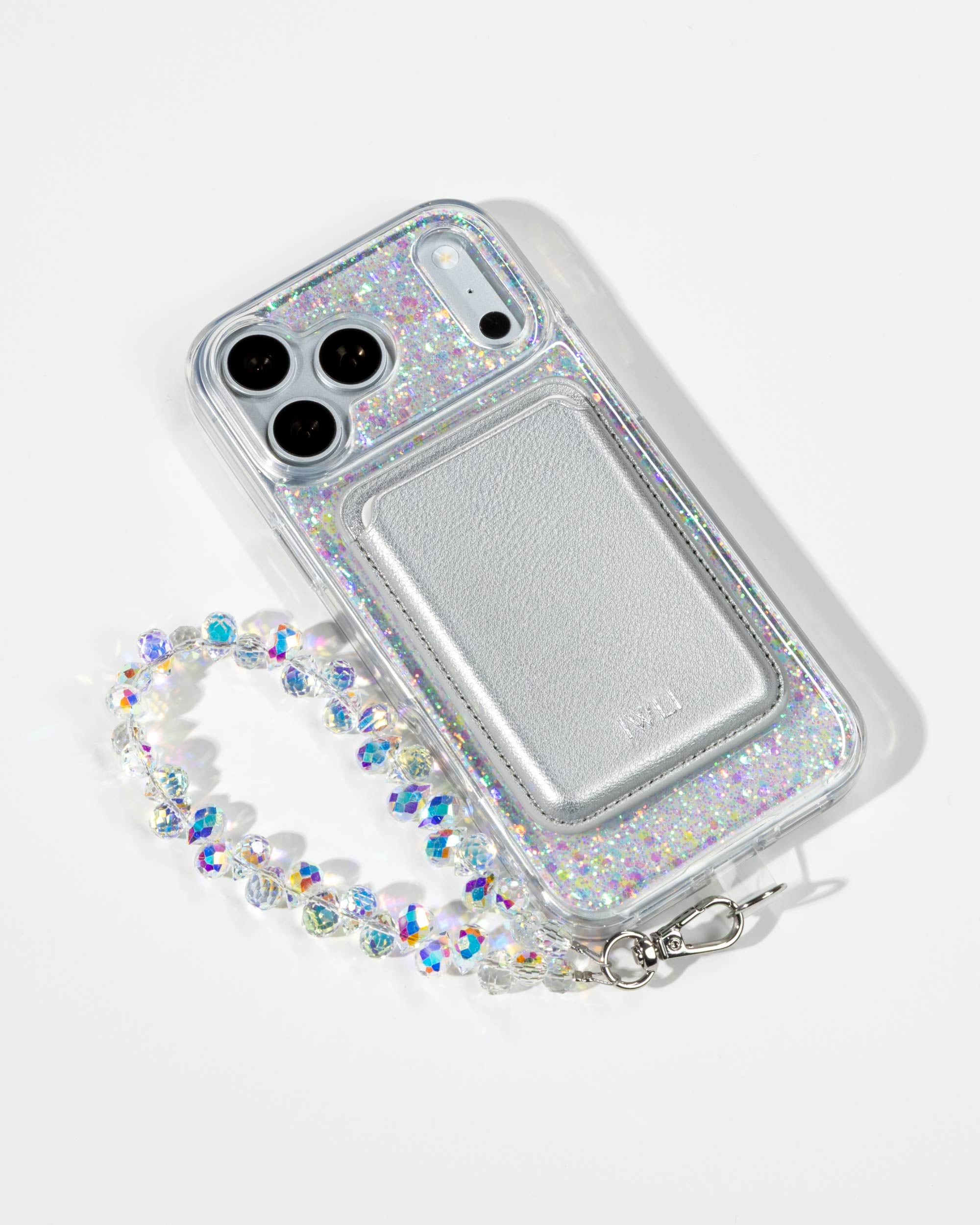 Opal Sparkle iPhone Case with a Silver Muse MagSafe Wallet attached