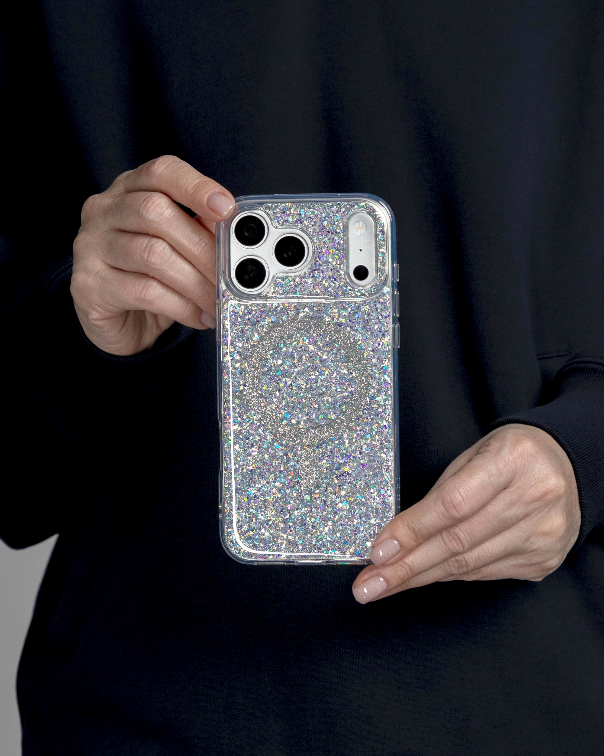 Silver Sparkle iPhone Case held in both hands, iPhone 17 Pro Max