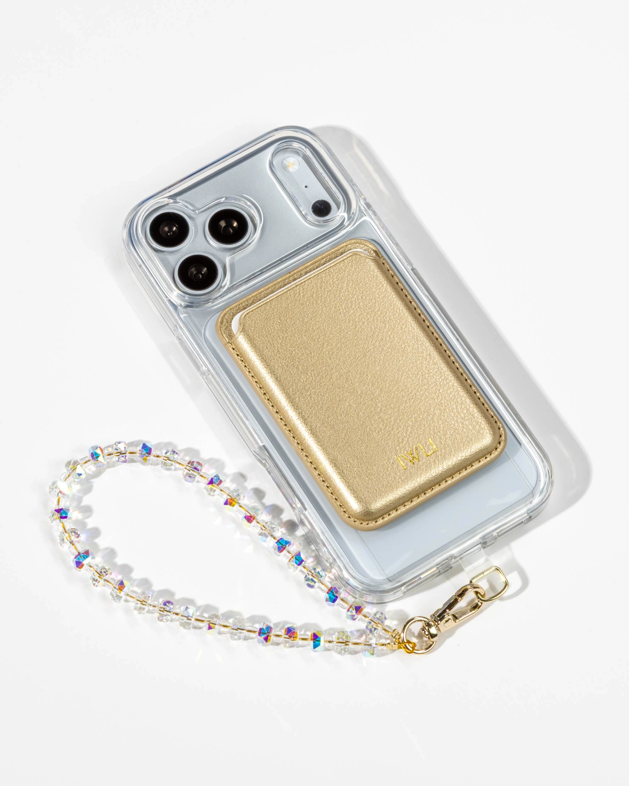 Gold Muse MagSafe Wallet attached to a Clear iPhone Case