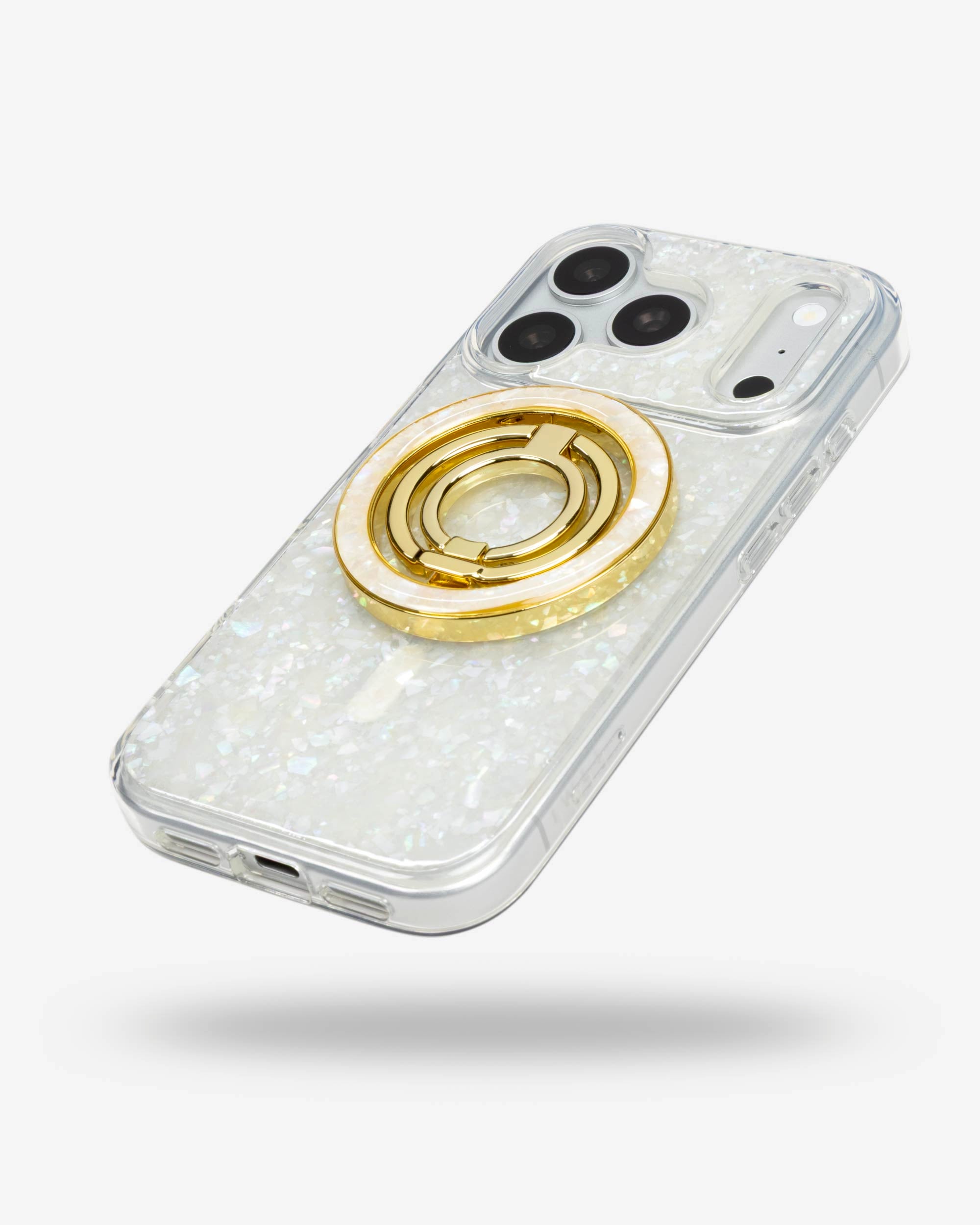 Snow Pearl Ring Stand, gold-tone, folded flat on the back of an iPhone case