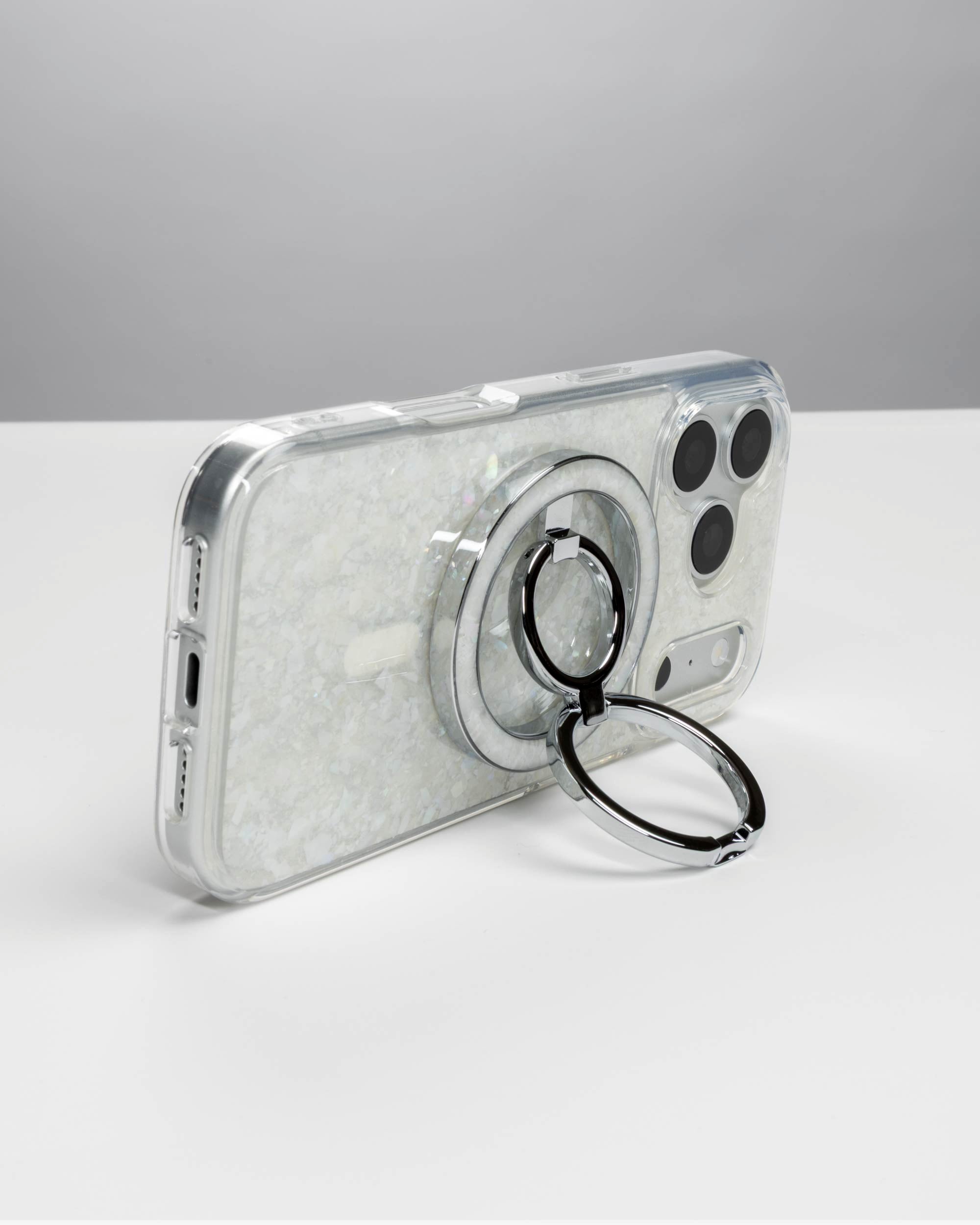 Snow Pearl Ring Stand, silver-tone, holding an iPhone in landscape as a stand