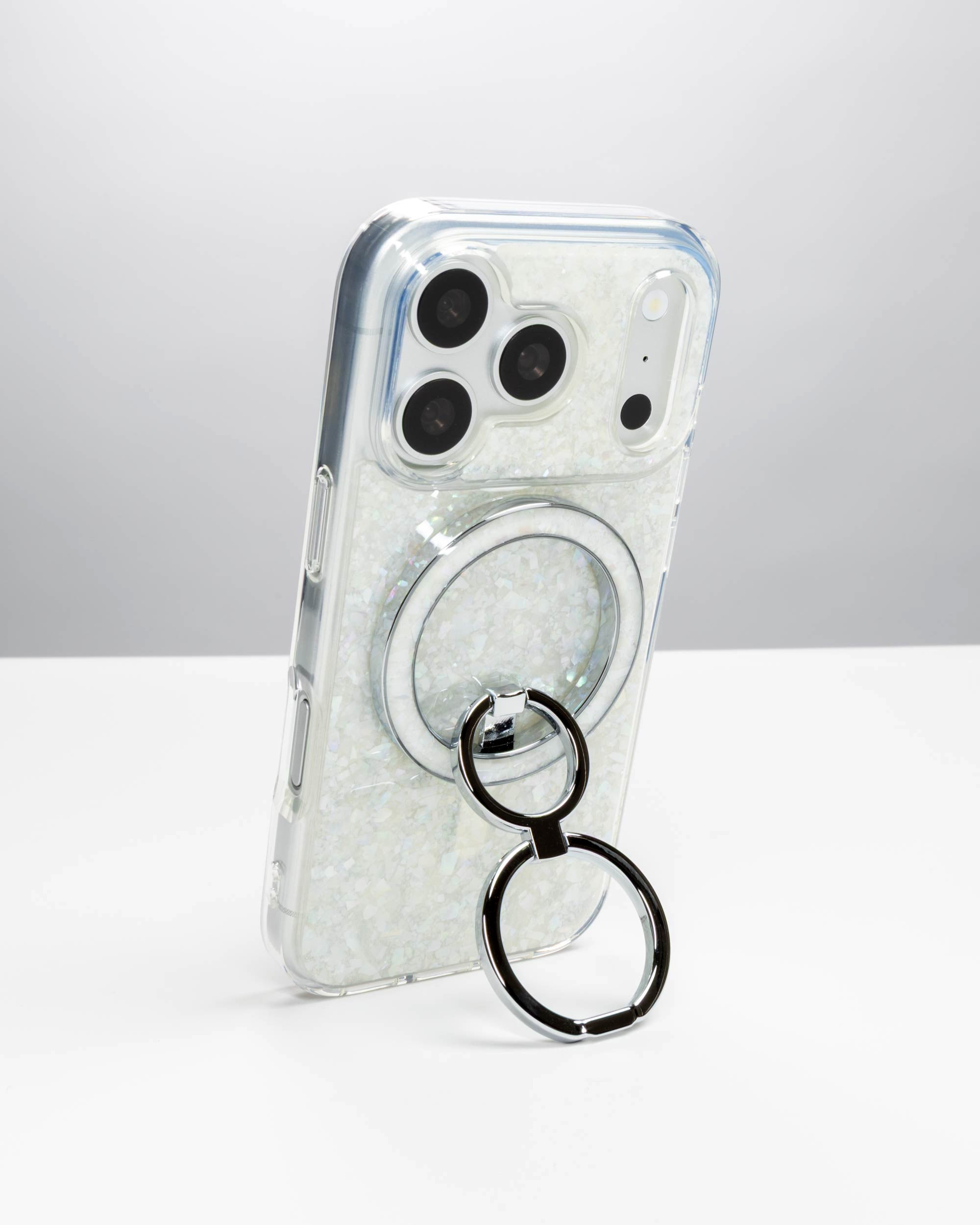 Snow Pearl Ring Stand, silver-tone, holding an iPhone upright as a stand