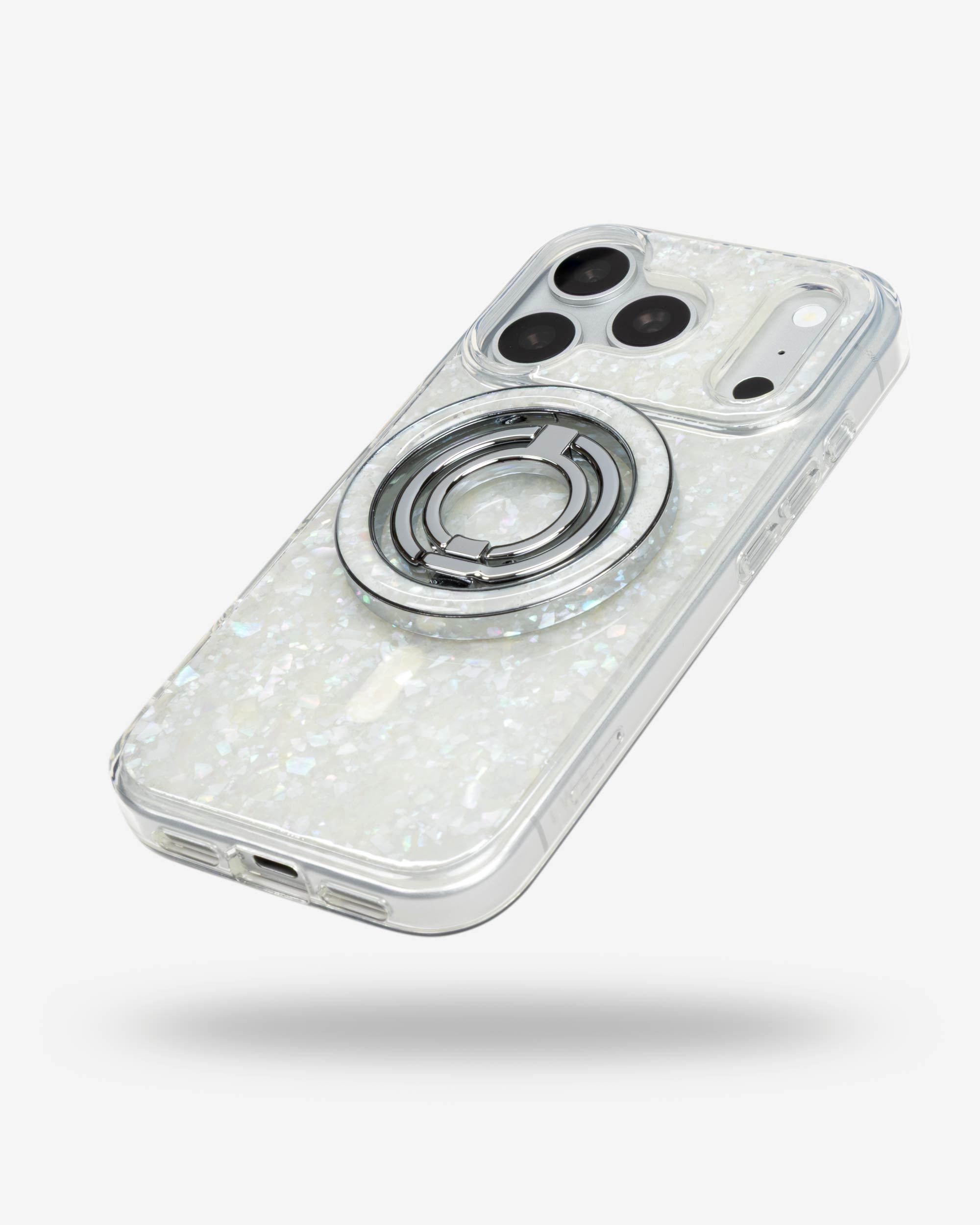Snow Pearl Ring Stand, silver-tone, folded flat on the back of an iPhone case