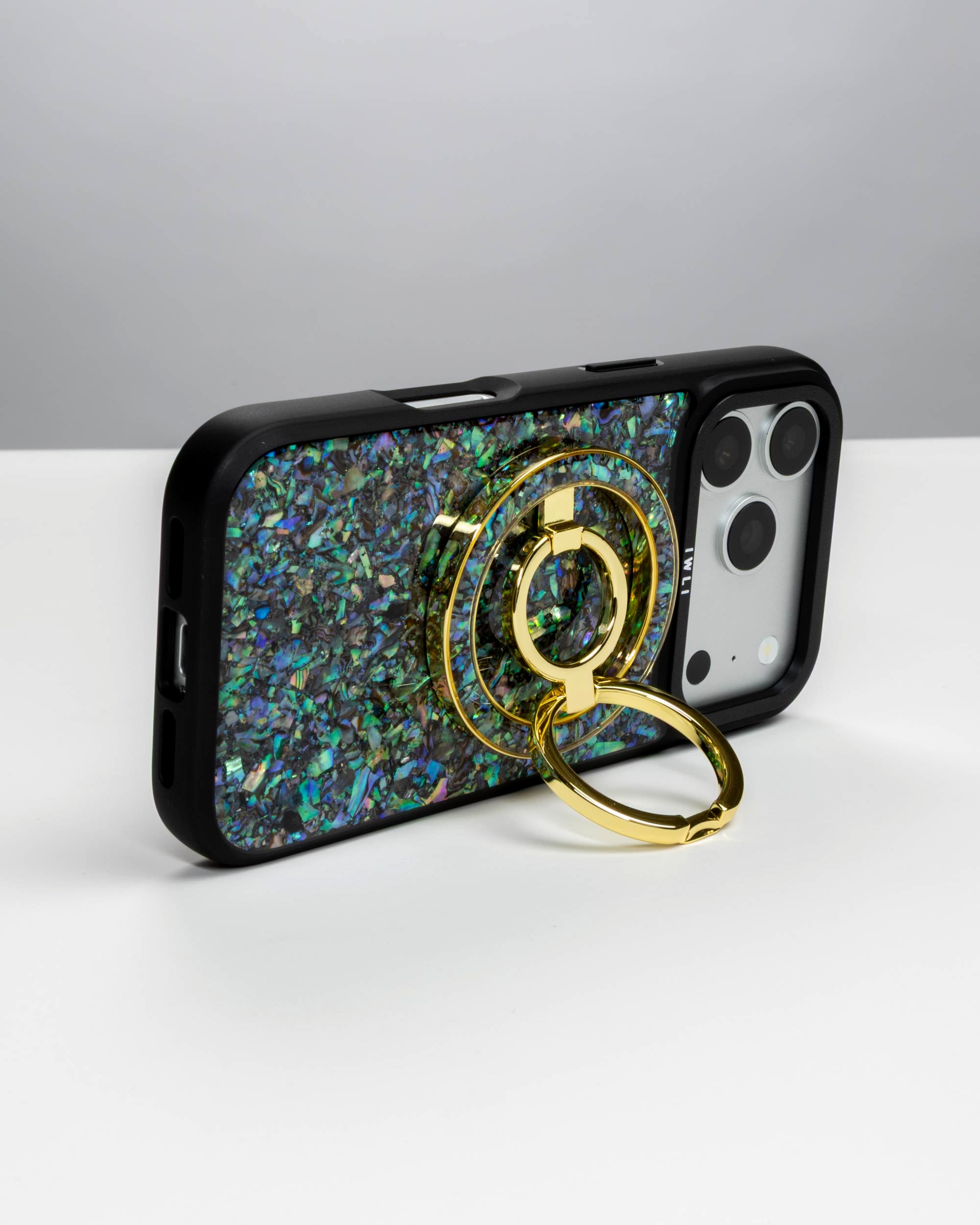 Abalone Pearl Ring Stand, gold-tone, holding an iPhone in landscape as a stand