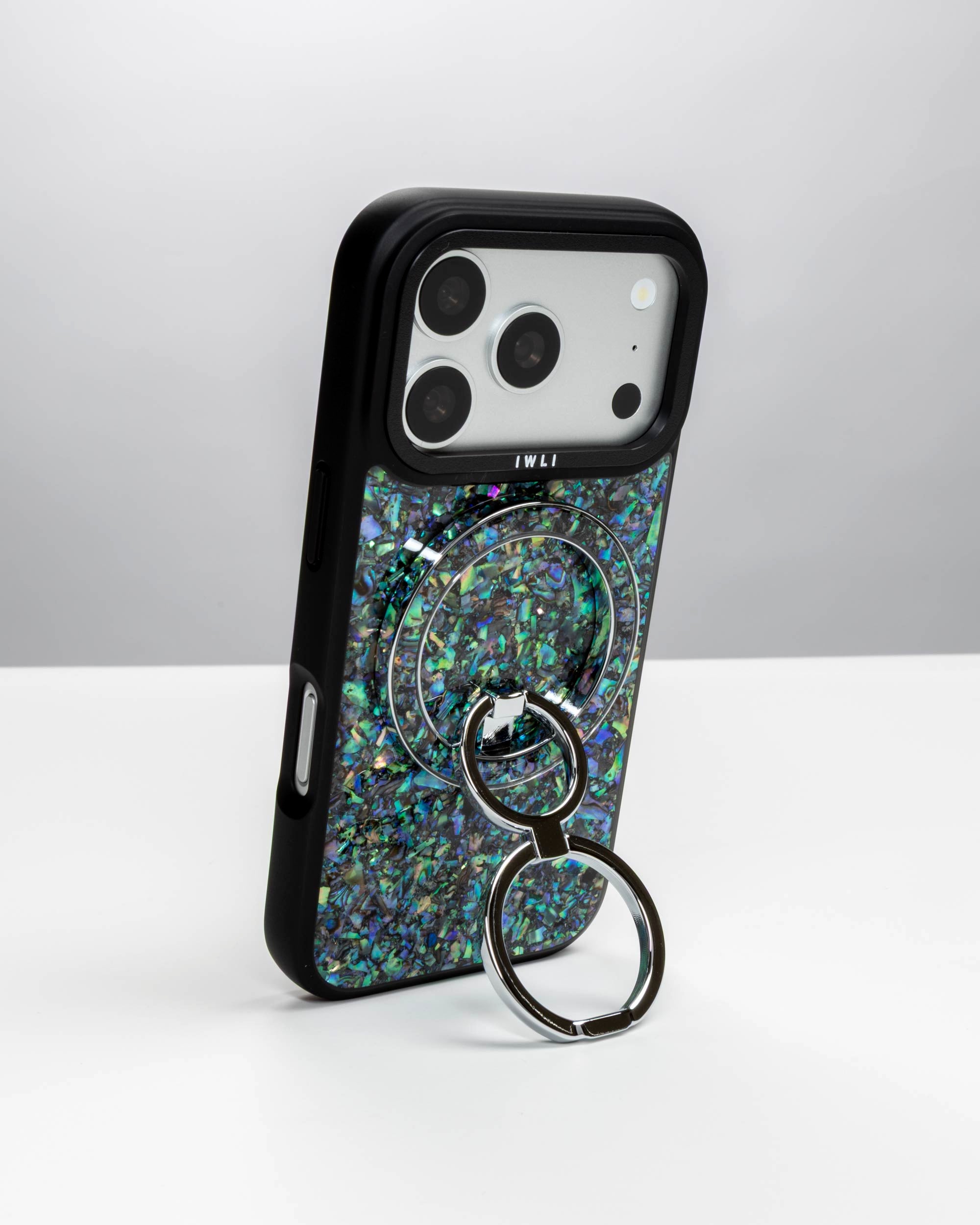 Abalone Pearl Ring Stand, silver-tone, holding an iPhone upright as a stand