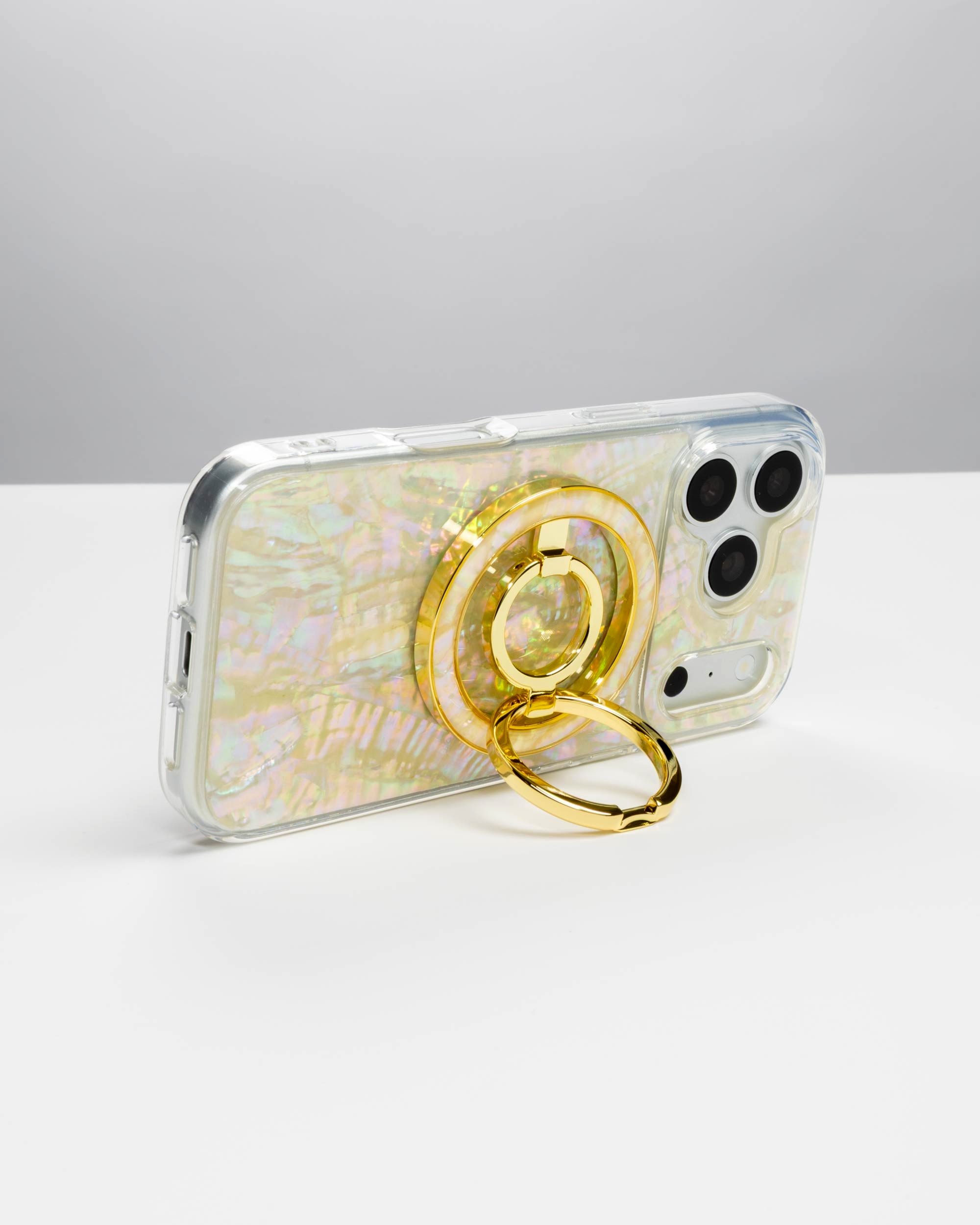 Opal Pearl Ring Stand, gold-tone, holding an iPhone in landscape as a stand