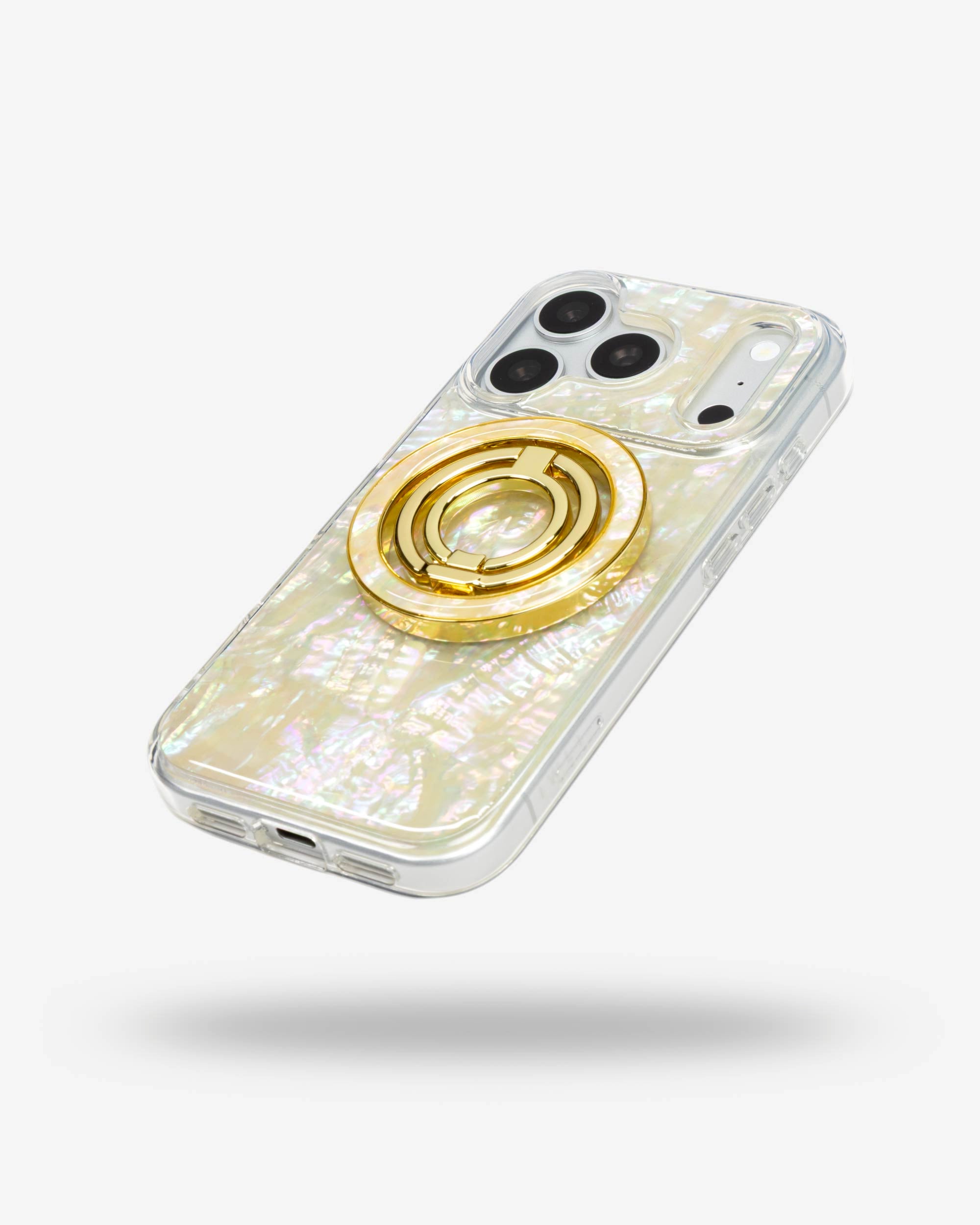 Opal Pearl Ring Stand, gold-tone, folded flat on the back of an iPhone case