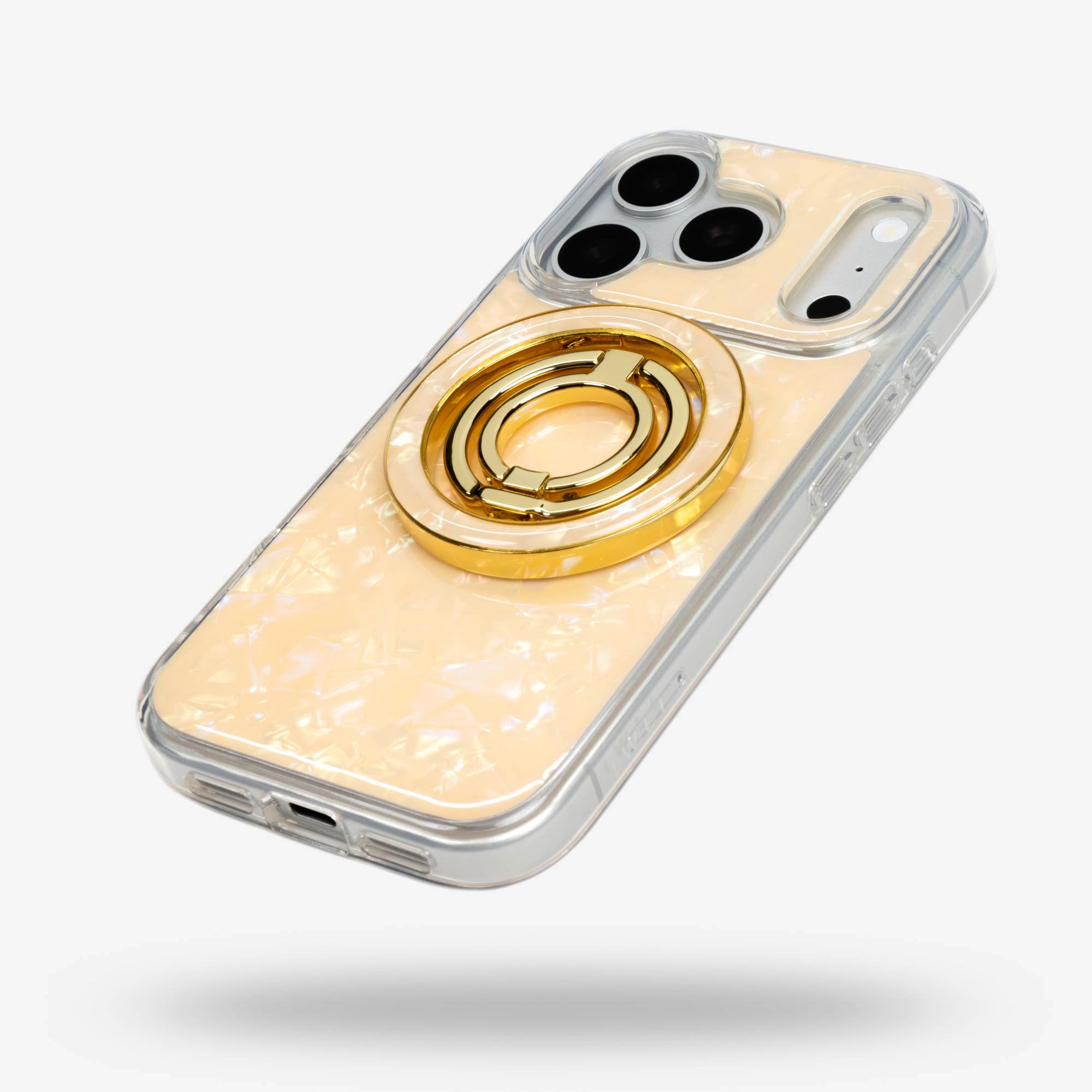Apricot Shell Ring Stand, gold-tone, folded flat on the back of an iPhone case
