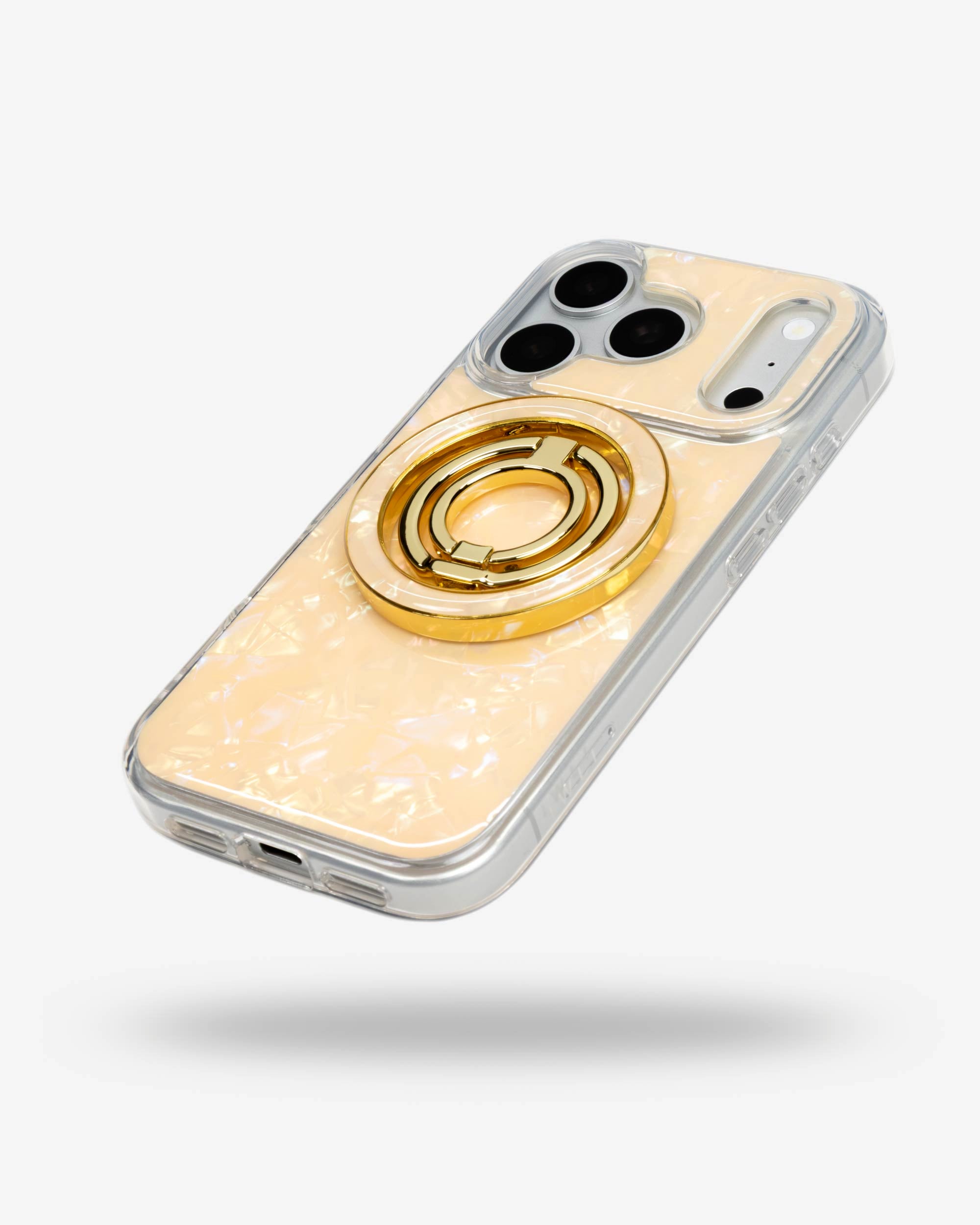 Apricot Shell Ring Stand, gold-tone, folded flat on the back of an iPhone case