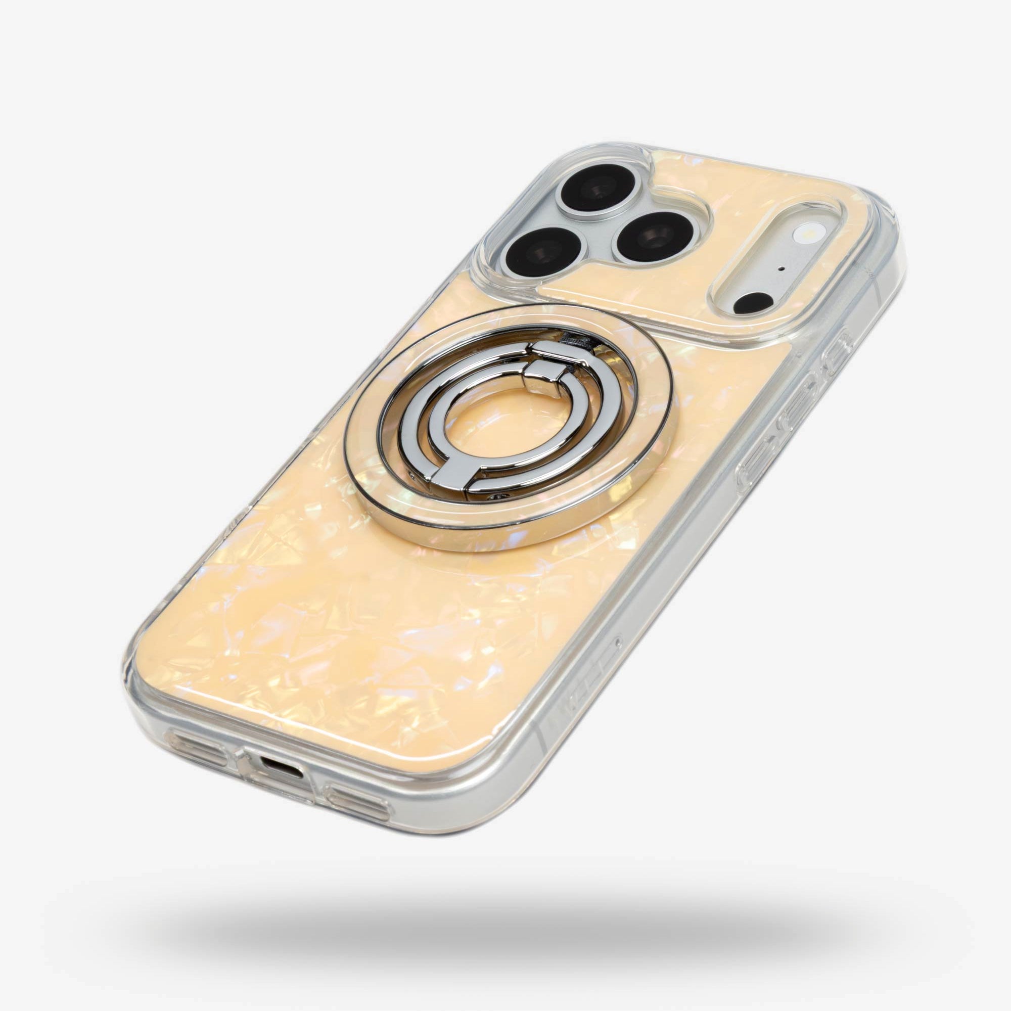 Apricot Shell Ring Stand, silver-tone, folded flat on the back of an iPhone case
