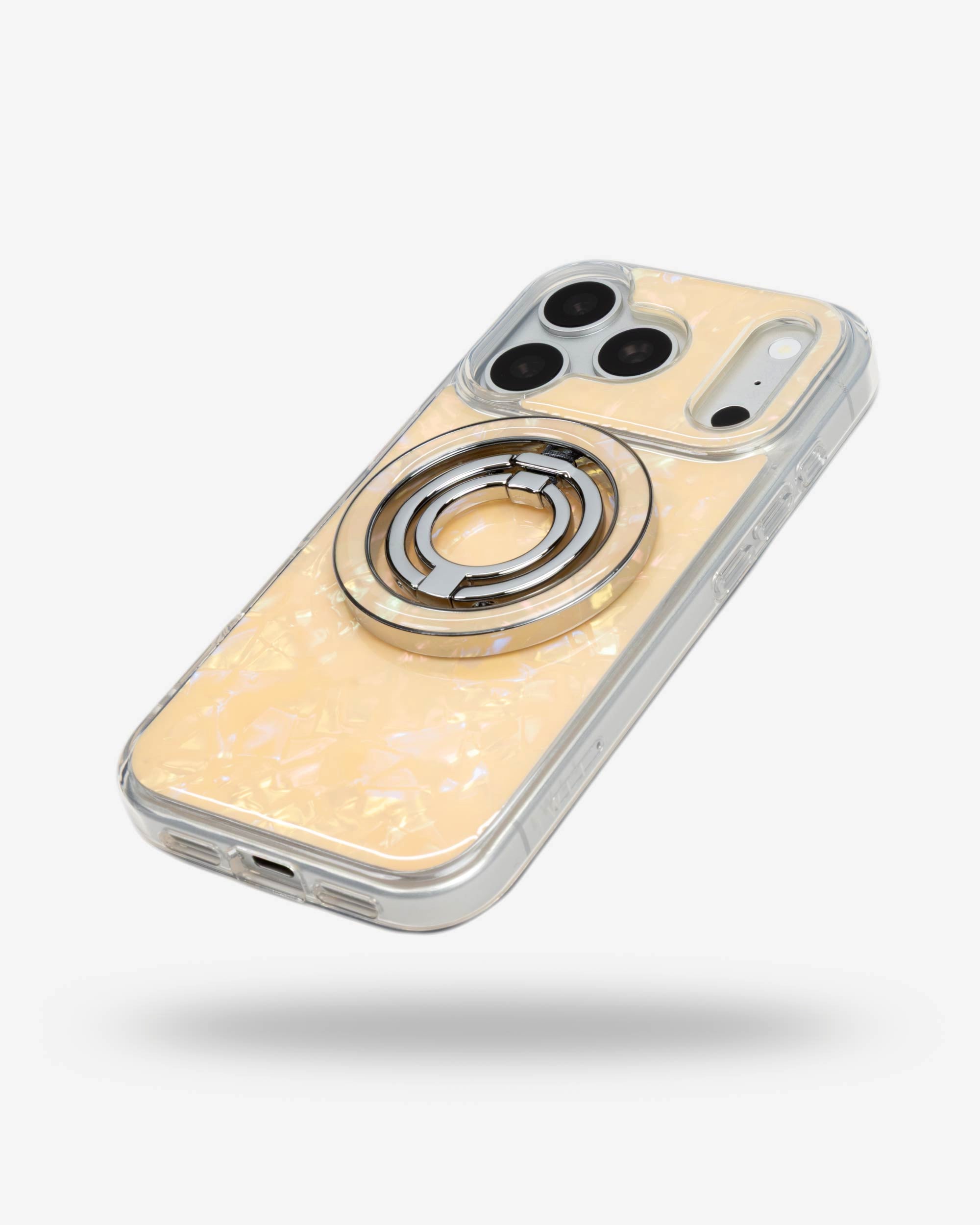 Apricot Shell Ring Stand, silver-tone, folded flat on the back of an iPhone case