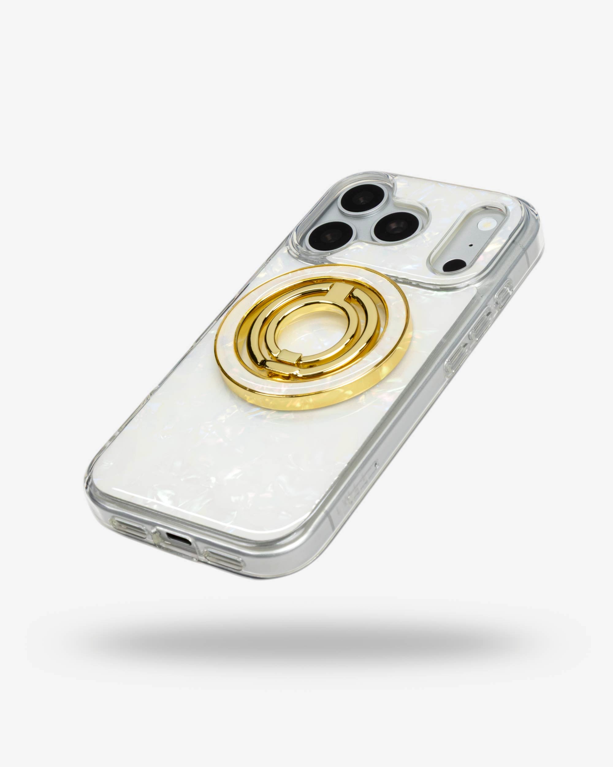 White Shell Ring Stand, gold-tone, folded flat on the back of an iPhone case