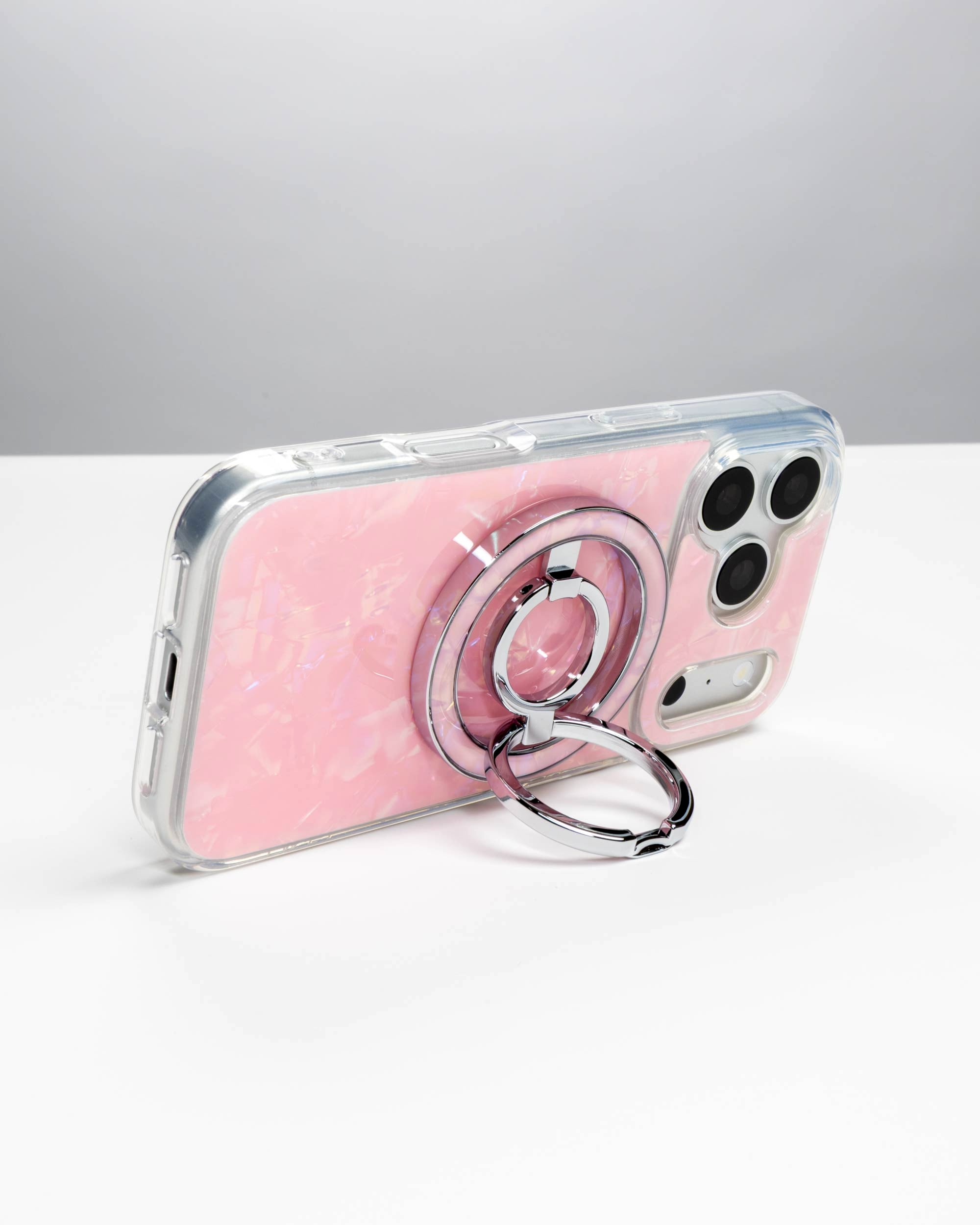 Pink Shell Ring Stand, silver-tone, holding an iPhone in landscape as a stand