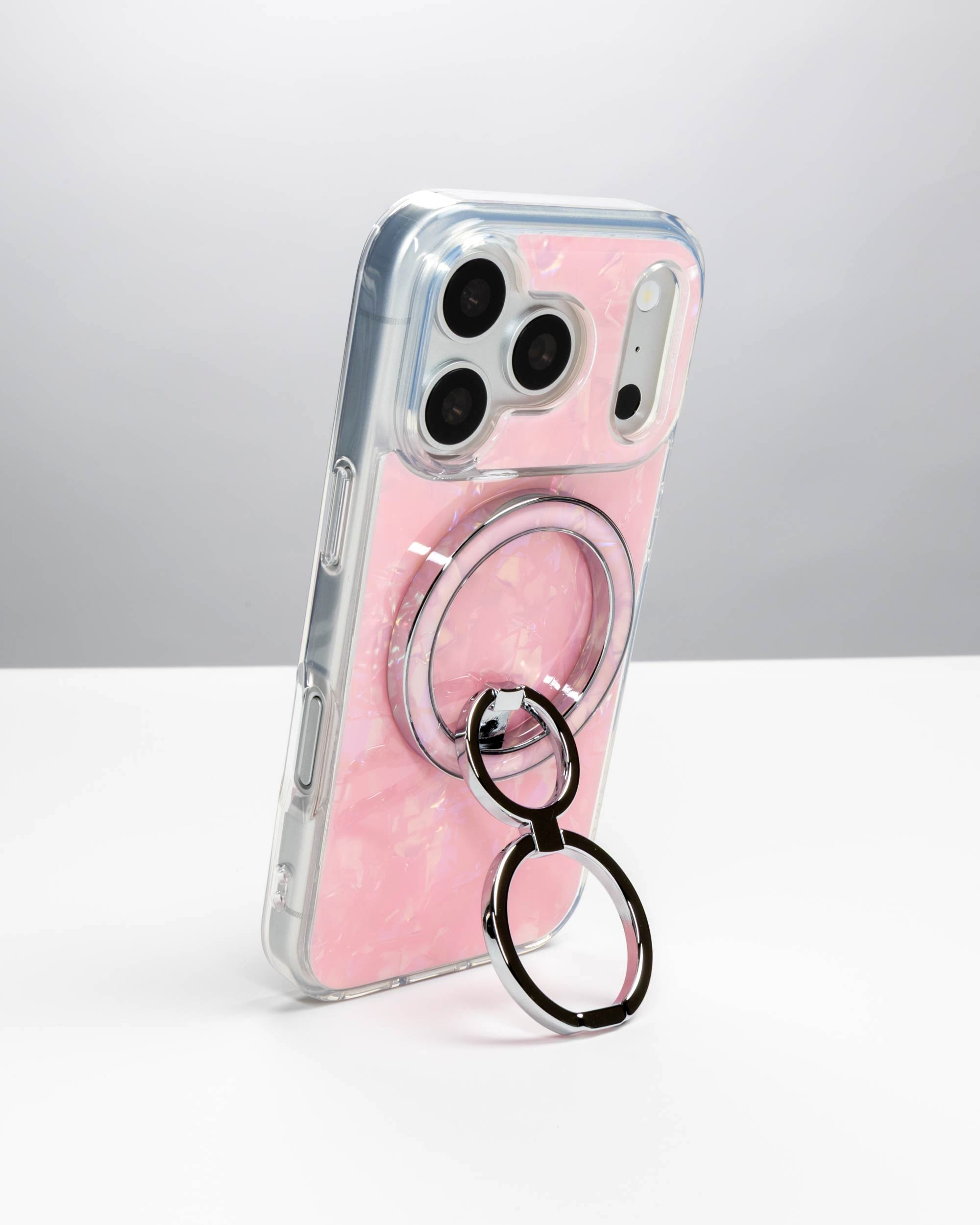 Pink Shell Ring Stand, silver-tone, holding an iPhone upright as a stand