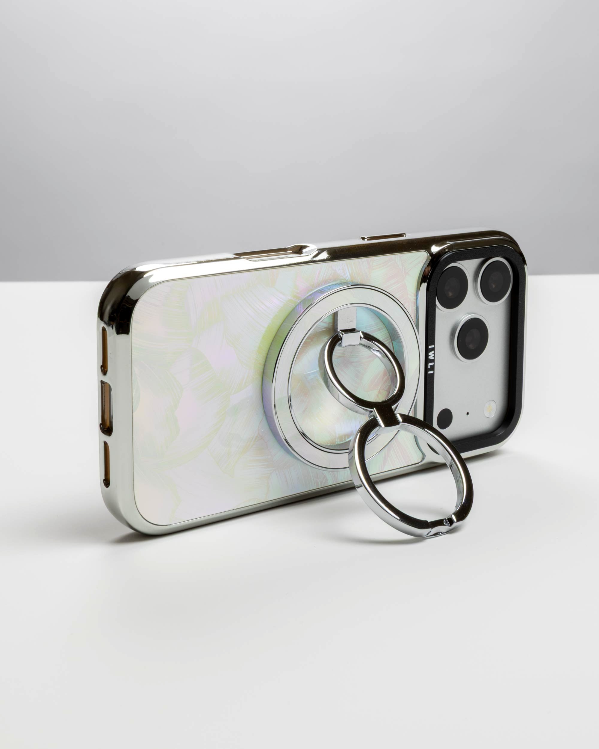 Pastel Petal Holo Ring Stand, silver-tone, holding an iPhone in landscape as a stand