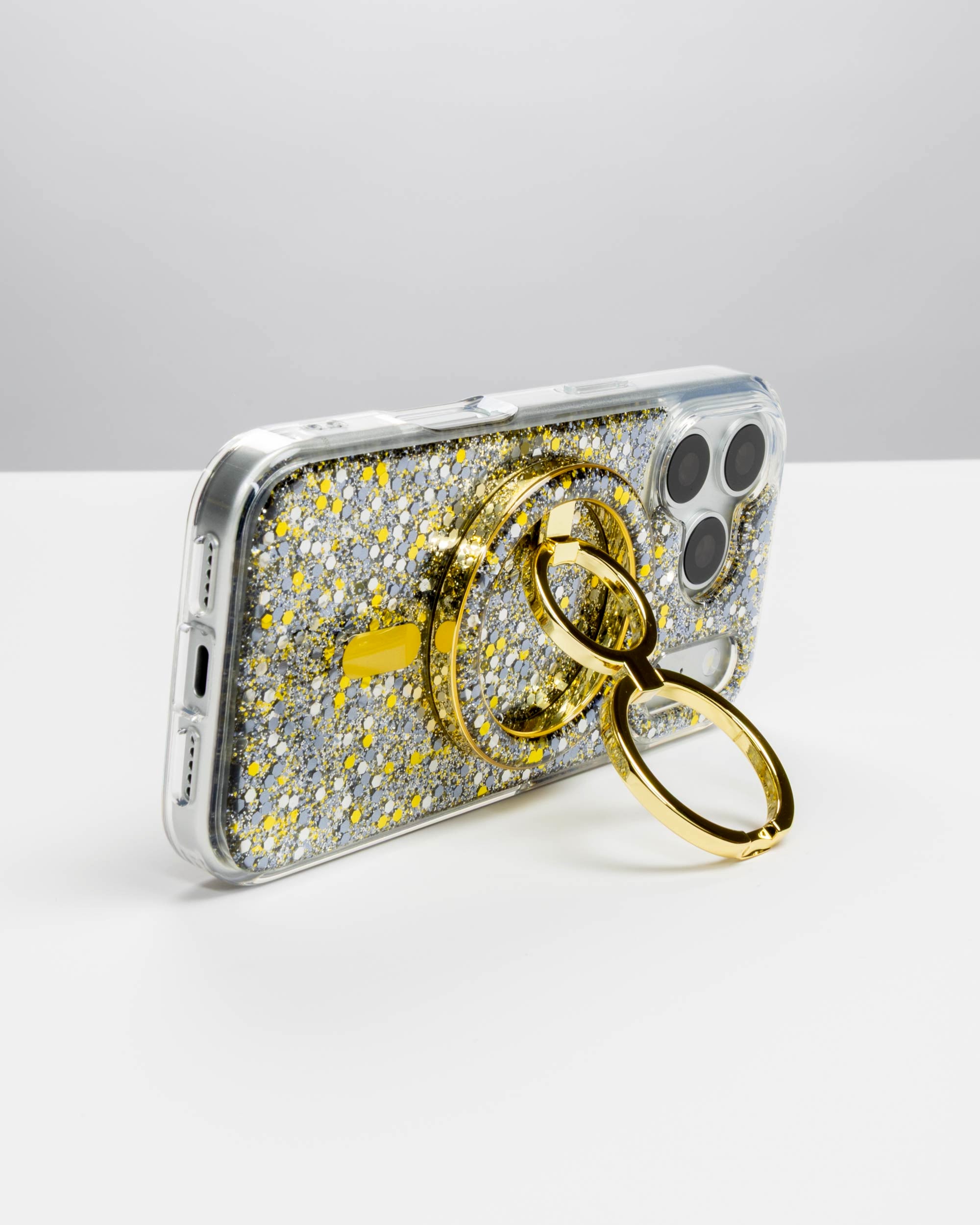 Starlight Sparkle Ring Stand, gold-tone, holding an iPhone in landscape as a stand