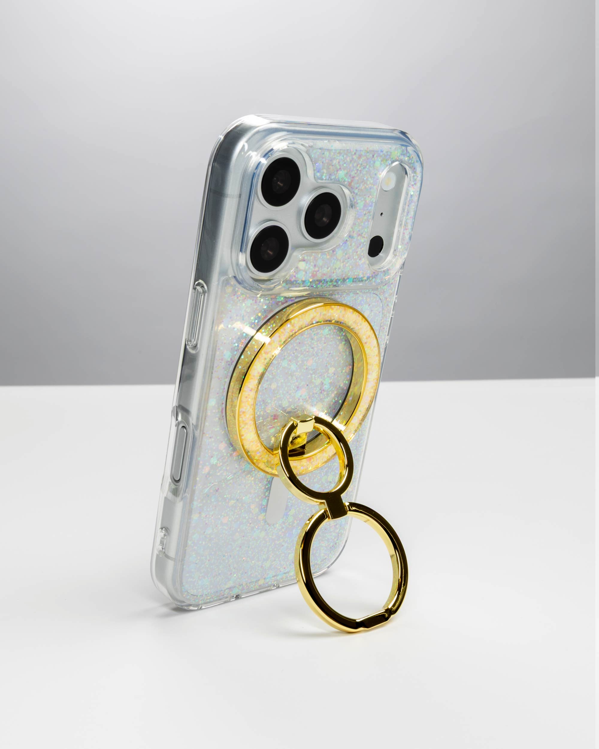 Opal Sparkle Ring Stand, gold-tone, holding an iPhone upright as a stand