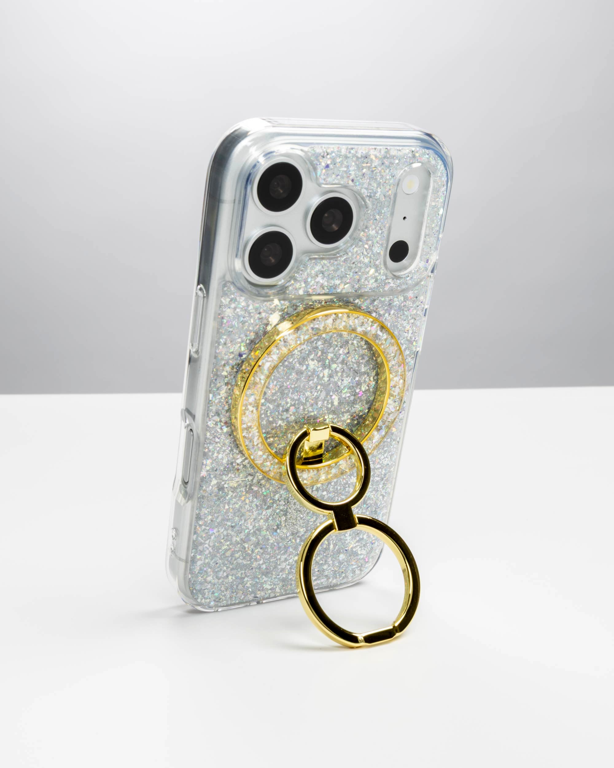 Silver Sparkle Ring Stand, gold-tone, holding an iPhone upright as a stand